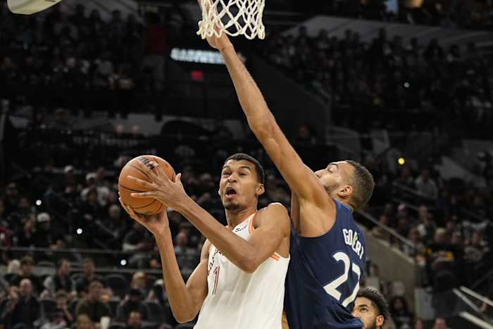 Nov 10, 2023; San Antonio, Texas, USA; San Antonio Spurs forward Victor Wembanyama (1) drives to the basket against Minnesota Timberwolves center Rudy Gobert (27) during the first half at Frost Bank Center.